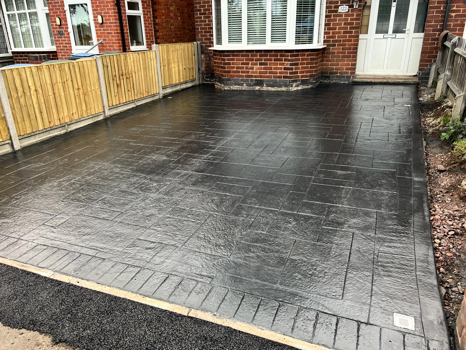 Herringbone pattern imprinted concrete driveway installed by Toor Concrete Driveways